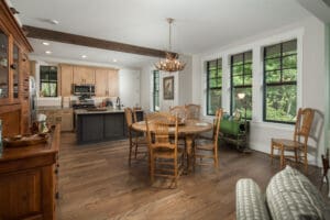 Rustic kitchen and dining area with windows.