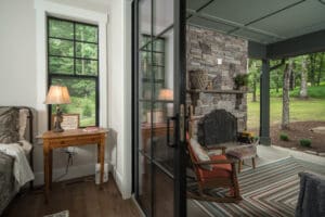 Cozy room with fireplace and outdoor view.