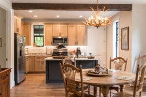 Cozy kitchen with dining table and chandelier.